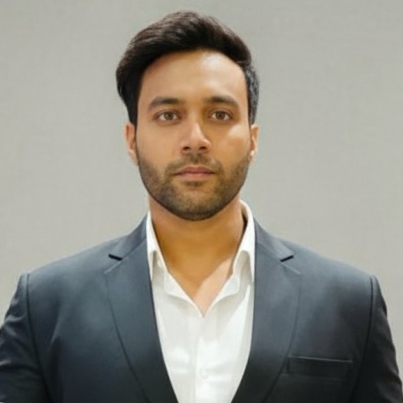 Professional man in gray suit with white shirt in corporate setting